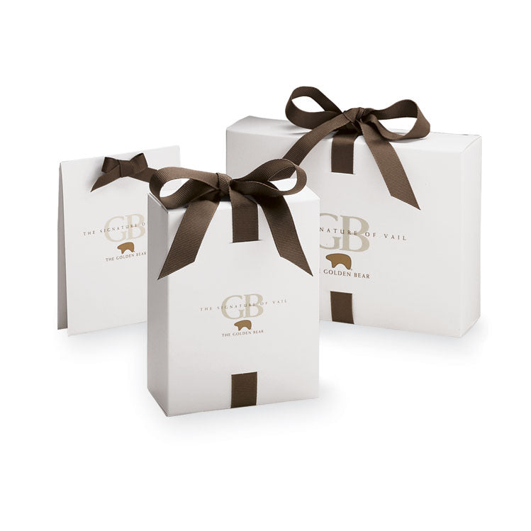 A group of small, medium, and large white gift boxes with brown bows
