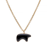 Onyx stone bear pendant on a gold chain against a white background