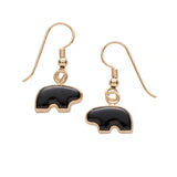 Gold earrings with onyx stone bear  on a white background
