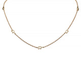 14k yellow gold necklace with tiny silhouette bears on white background
