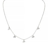 Silver necklace with small bear charms on a white background
