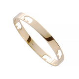14k yellow gold bangle with cut out bears on a white background