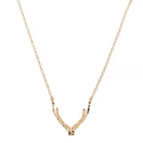 Gold antler-shaped pendant on a chain against a white background