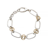 Bracelet with silver and gold chain links on a white background