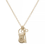 Gold necklace with a unique pendant on a white background