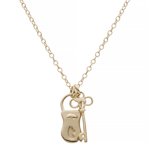Gold necklace with a unique pendant on a white background