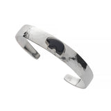 Silver bracelet with a onyx bear on a white background