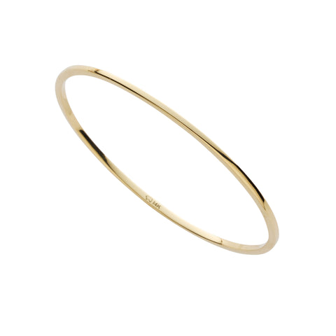 Gold bangle on a white background