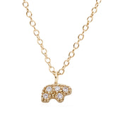 Gold necklace with a bear-shaped pave diamond pendant on a white background