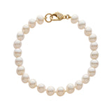 Pearl bracelet with pave diamond gold clasp on a white background