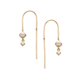 Gold earrings with pearl  and diamond 
drops on a white background