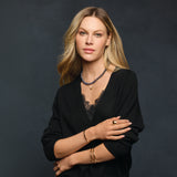 Model wearing gold dome ring
